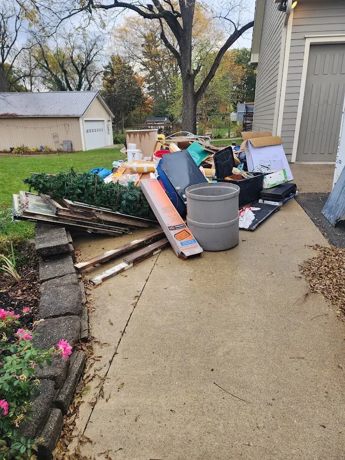 Dumpster being loaded with debris for Commercial Dumpster Rental in Galveston